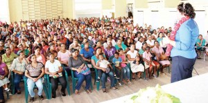 Minister Manickchand addressing the massive gathering at the Anna Regina Secondary School yesterday.