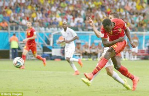 Super sub: Belgium striker Romelu Lukaku unleashes an exquisite finish to double Belgium's advantage