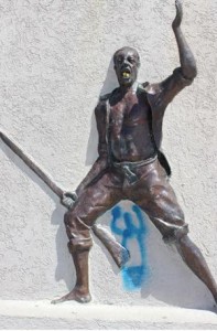 The defaced monument at the sea wall.