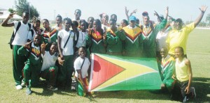 CHAMPS AGAIN! The victorious Junior National Athletics Team celebrates in a photo moment at the GDF Ground yesterday after reclaiming the IGG title from Suriname.