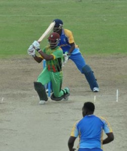 Shemron Hetmyer pulls on one knee during his century.