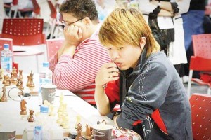 Haifeng Su and Maria Thomas in deep concentration during the 8th game yesterday. (photo compliments of Wendel Meusa)