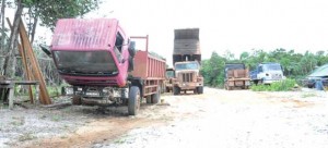 Several of the trucks in the camp rotting away.