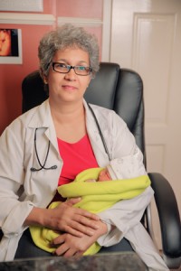 Dr Madhu Singh cradles the IVF newborn 