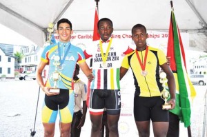 Alanzo Ambrose (right), Junior Road Race bronze medalist with the gold medal winner (centre) and silver medalist. 
