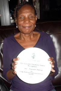 Retired Special Needs Educator, Ingrid Peters, displays a plaque she received from the Guyana Teachers’ Union for Long, Dedicated and Conscientious service