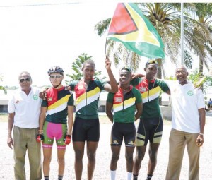 Proud Moment! The Guyanese riders pose with Coach Hassan Mohamed (left)  and Manager William Howard after the Road Race win.