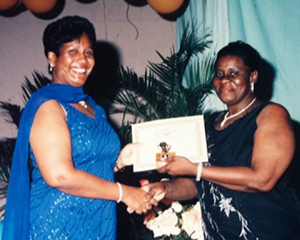Receiving the ‘Most Outstanding Supervisor’ ACDC Award from Hospital Matron Loretta Alexander, in 2004