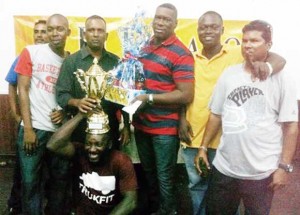 The winning police team; (from left) Aden Chisholm, Assistant Supt. Boodnarine Persaud, Assist Supt. and Captain Terrence Brown,  C.O Alistair Roberts, Petamber Sookra, while stooping is Anthony Scipio.  