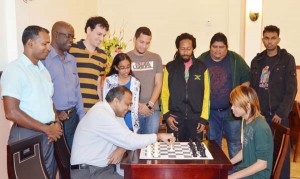 In this photo, Dr Anthony moves the first pawn against national junior champion Haifeng Su to signal the start of the competition. 