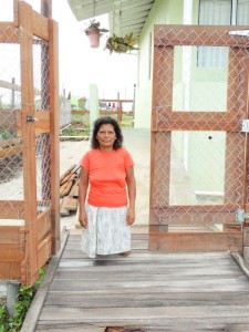 Amanda Anthony poses near her new gate and fenced property.