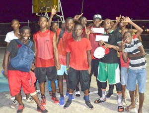 Nikkoloi Smith’s Plaisance team members pose for a photo opportunity following their win at the National Gymnasium Sunday night.
