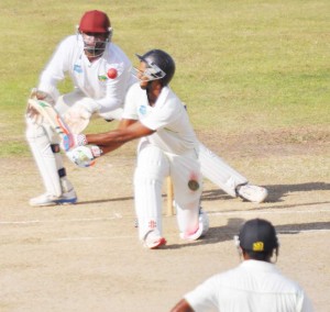 Shiv Chanderpaul misses a sweep at Alston Bobb during his unbeaten 31 yesterday at Providence.