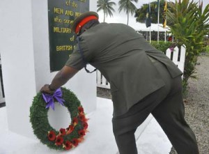 Chief-of-Staff of the Guyana Defence Force, Brigadier Mark Phillips laying a wreath in memory of the fallen soldiers.