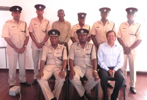 Commander Senior Superintendent Marlon Chapman and Member of Parliament and CEO of the Berbice Regional Health Authority, Dr Vishwa Mahadeo with other senior ranks of the Division.