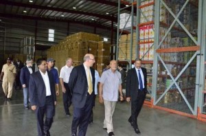 President Donald Ramotar being given a tour of the Courts Distribution Centre