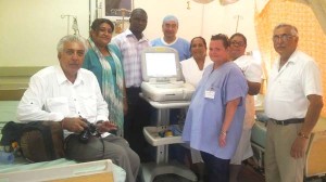Members of both the Sai Baba organisation and local doctors with the ECG machine donated to the New Amsterdam Hospital
