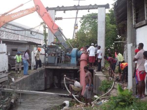 Persons worked tirelessly on Thursday to rectify the problem at the Sussex Street koker.