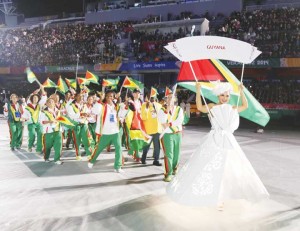 The Guyanese athletes led by flag bearer Gabriella Xavier of hockey during the opening ceremony.