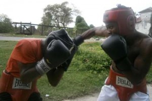 Richard Williamson (left) and Derrick Richmond spar during a session at the Pocket Rocket Gym in New Amsterdam.