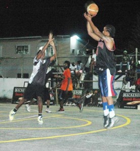 TOO LATE! Unknowns’ Keon Cameron (left) is too late as he scampers to prevent the sublime sharp-shooting guard, Chris Williams from landing another dagger from atop the key at MSC Hard Court in Linden.