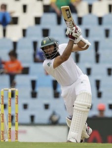 Hashim Amla goes through the off side. (Associated Press)