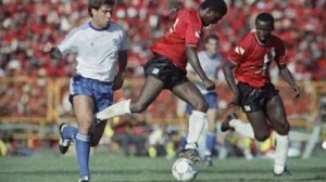 In this Nov. 19, 1989, file photo, Paul Caligiuri, left, of the United States, and Russell Latepy, center, of Trinidad and Tobago fight for control of the ball at National Stadium in Port-of-Spain, Trinidad. (AP Photo/Mark Lennihan, File) (The Associated Press)
