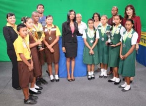 Ms. Gitanjali  Chandarpal, Head of the Office of Climate Change, with teachers and other officials and the two teams that participated in the Finals – Annai Secondary School and Covent Garden Secondary School