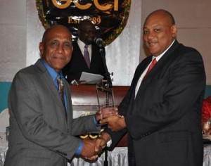 Gordon Lyken of Lyken’s Funeral Parlour collects the Lifetime Achievement Award from House Speaker, Raphael Trotman