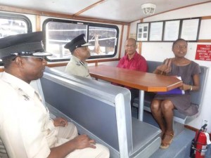 Minister Rohee and senior police officers take a ride onboard the MV Baramain 