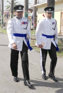 COP (Ag) Seelall Persaud (left) and his Personal Assistant make their way to yesterday’s awards ceremony.  