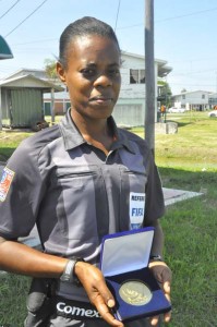 SGT Maurees Skeete shows off her CONCACAF Women’s Championship Medal.