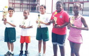  (From left) Mae’s Representative for Best School, Nathan Wills of Green Acres Primary, Ashanti Persaud from Mae’s Under 12, Armani Wachira of Georgetown International Academy and Sunnah Sealy of Redeemer Primary display their prizes.