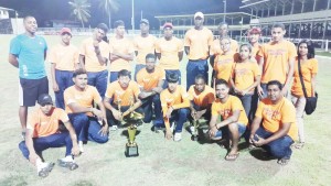 Members of the victorious Universal DVD Berbice Titans display their prizes with Chief Executive Officer of Universal Solutions and Universal DVD Store Vickram Seubarran (stooping at far right). Coach Julian Moore is at standing at extreme left. 