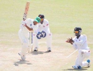 Vishaul Singh gathers runs during his responsible innings. 