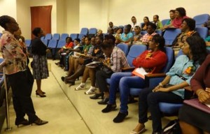 Madam Justice Roxanne George addressing a group of women during the conference