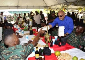 President Donald Ramotar sharing meals yesterday to junior ranks of the Guyana Defence Force at Camp Stephenson, Timehri.