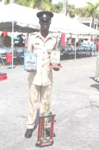 2014 Best cop Inspector Johnson with his plaque and trophy. 