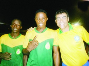 Coach of the GDF unit, Brazilian, Caetano (extreme right) with two of his point men (Delwyn Fraser at left) celebrate. 