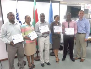 The Guyana team with their certificates. (L-R) Clive McDonald, La Verne Vyphus, Geoffrey Babb, Akosua McPherson, Ronald McIntyre, and Facilitator Paul Lattanzi of the UNEP.