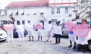 Nurses protest in solidarity with colleagues, Sharon Chase (left) and Shandra Hanover (second from left).