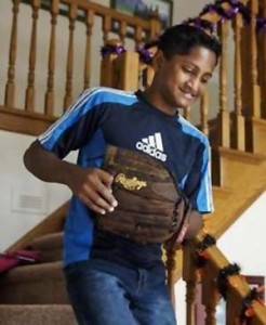 In this Oct. 27 photo, Satchian Basdeo rushes down the stairs of Dr. Kristen Ferguson’s home in Springfield, on his way to play catch with her son, Brenden. Basdeo underwent the surgery for his condition in April.