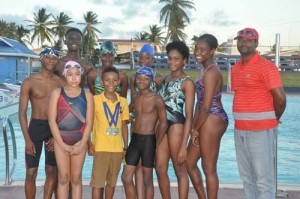 Members of the Guyana team just before a training session at the National Aquatic Centre. Manager Leon Seaton Snr is at far right.