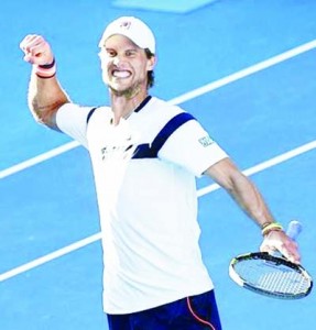 Andreas Seppi of Italy celebrates after defeating Roger Federer of Switzerland in their men’s singles third round match at the Australian Open 2015 tennis tournament in Melbourne January 23, 2015.  Reuters/Athit Perawongmetha 
