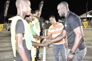  Guinness Brand Manager Lee Baptiste (right) and Region 3 Chairman Julius Faerber meet the two teams shortly before the start of competition on Saturday night.