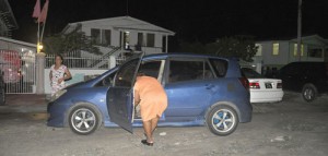 Relatives retrieves the victim's  belongings from her car 