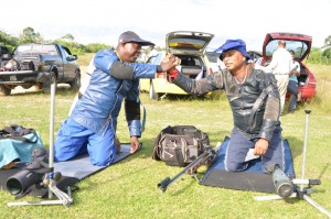 National fullbore Individual champion Lennox Braithwaite (left) being congratulated by National Captain Mahendra Persaud after sealing the title.    