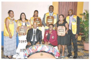Seated: Justice Brassington Reynolds (left) and District Governor 60A Maxine Cummings. Standing from  left are Odessa De Barros- President of the Georgetown Stabroek Lions Club, Indira Anandjit,  Petal Ridley, Thomas Nestor, from the Diamond-Grove Lions Club,  Diana D'Ornellas from the  Georgetown Stabroek Lions Club  and President of Diamond-Grove Lions Club, Ivan Waite.