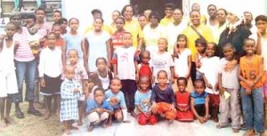 Mrs. Johnson (centre) and members of the All Saints’ Anglican Church Mothers’ Union at a recent outreach to children at the Berbice Anjuman Orphanage