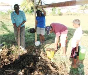 Residents of Block CC Mon Repos gathering their compost